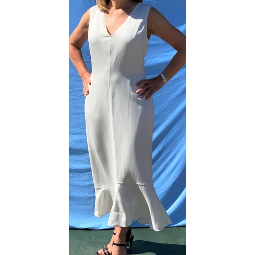 228 - Victoria Beckham - a white triple georgette belted midi dress with panelled frill hem, size 14, with... 
