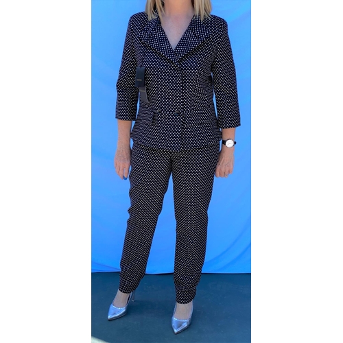 241 - Escada - a 2 piece trouser suit, black polka dot effect, 3/4 sleeves, peplum style jacket, with orig... 