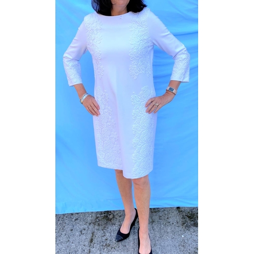 244 - Escada - a heavy jersey white long sleeve dress with lace detail to front, size 40, original labels;... 