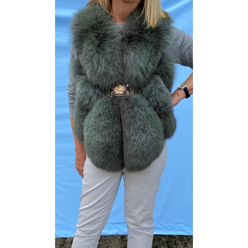 277 - A grey fox fur gilet with belt and another black fox fur gilet