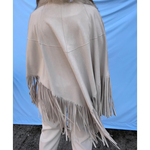 280 - A fan cape with pockets, long tasselled fringing and detachable silver fox fur collar
