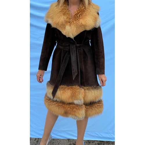 281 - A vintage 1970's dark brown suede coat with tie belt, fox fur collar and detachable fox fur band at ... 