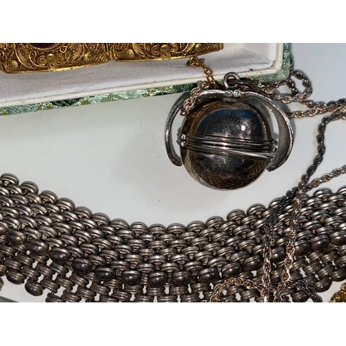 509 - A silver gilt filigree bracelet set amethyst coloured cabochon stones; costume jewellery