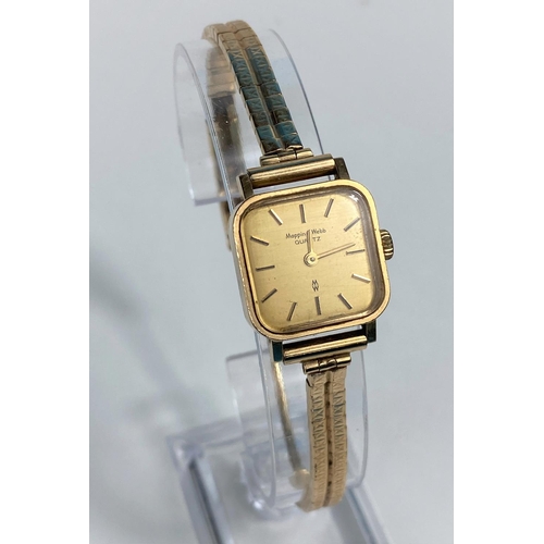 513 - A ladies 9 carat hallmarked gold quartz wristwatch by Mappin & Webb, on 9 carat hallmarked gold stra... 