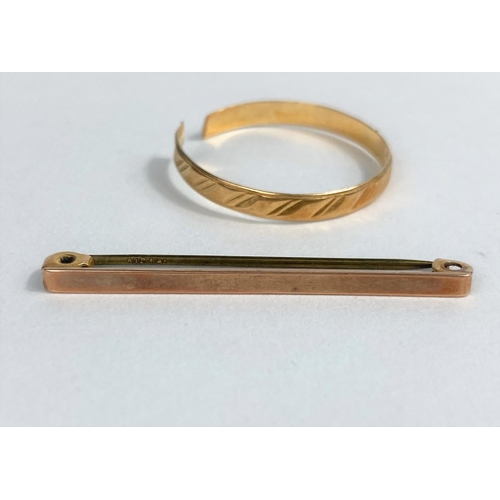 515 - A modern wedding ring stamped '70', (cut); a yellow metal bar brooch, stamped '9ct', 1 gm