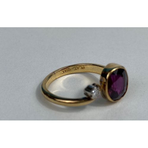 519 - A yellow metal double end ring set small diamond and oval ruby coloured stone, stamped '18ct', 7.3 g... 