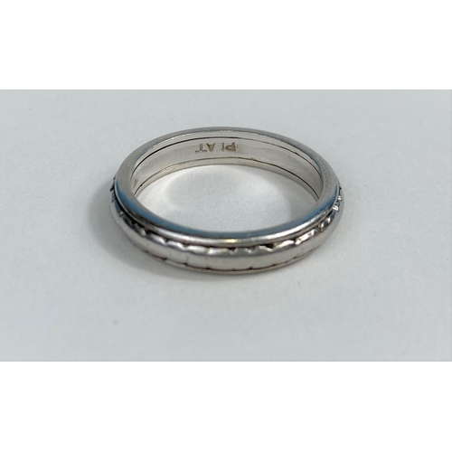 521 - A white metal wedding ring stamped 'Plat', 7.3 gm
