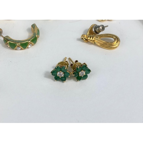 524 - A pair of earrings set green stones, stamped '585'; gilt metal costume jewellery
