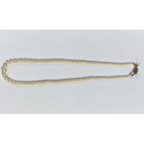 573 - A cultured pearl graduated necklace with pearl set clasp, stamped '750'