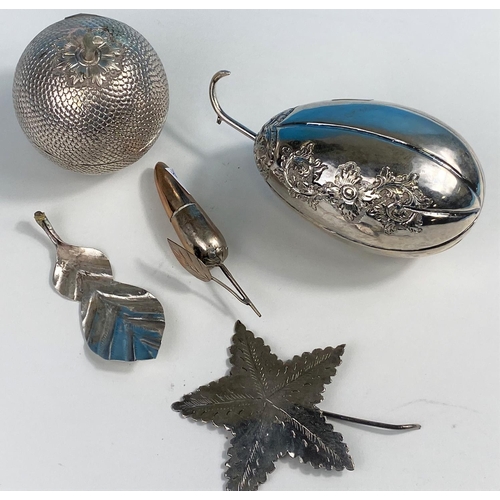 600A - A white metal trinket box in the form of a fruit with relief decoration and star shaped leaf (detach... 