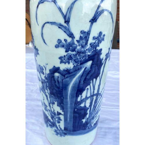 347 - A tall Chinese blue and white sleeve vase with floral design and incised circle of decoration around... 