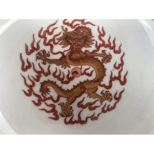 347C - A pair of Chinese famille jaune rice bowls with 4 dragon panels to exterior, central dragon to inter... 