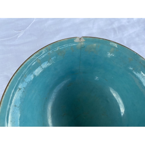 364A - A Chinese famille rose bowl with green glazed clouds with eyes; a turquoise interior and base, with ... 