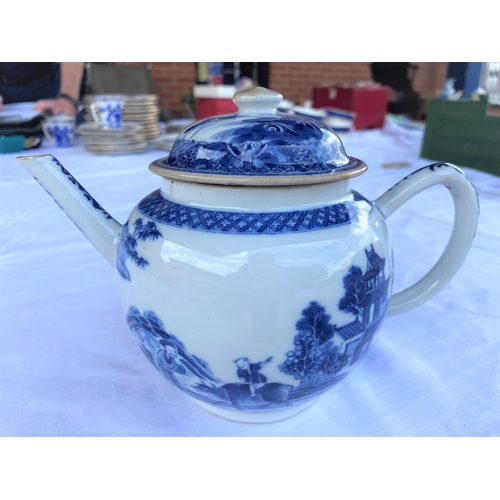 379B - An 18th century Chinese blue & white teapot with detailed decoration of country scenes, children rid... 