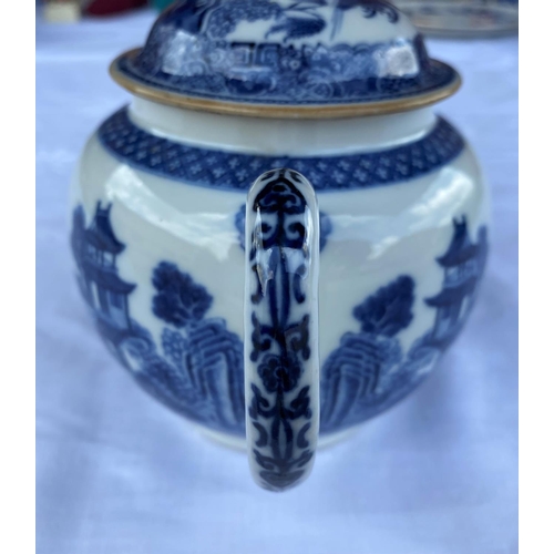 379B - An 18th century Chinese blue & white teapot with detailed decoration of country scenes, children rid... 