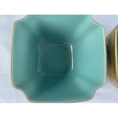 345F - A pair of Chinese squared tea bowls with gilt and polychrome decoration, turquoise interior, red sea... 