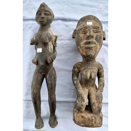 172 - Two carved wood African tribal figures of a woman height 46cm and 39cm