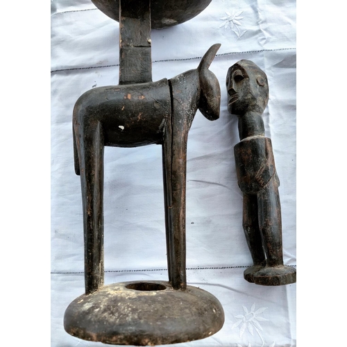 173 - A carved wooden tribal stand in the form of a 4 legged animal (split) height 46cm, two carved wooden... 