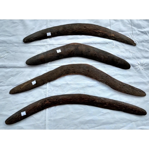 178 - Four Aboriginal tribal carved boomerangs, one with carved patternation, longest 62cm, shortest 49.5c... 