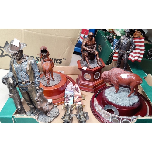 43 - A figure of John Wayne on horseback, and others related