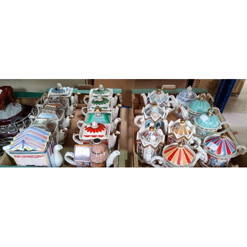 44 - A collection of decorative teapots