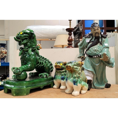 50 - A stoneware figure of a Chinese warrior; a Dog of Fo; etc.