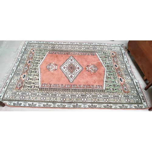 682 - A modern Persian design rug with pink ground, length 240 cm