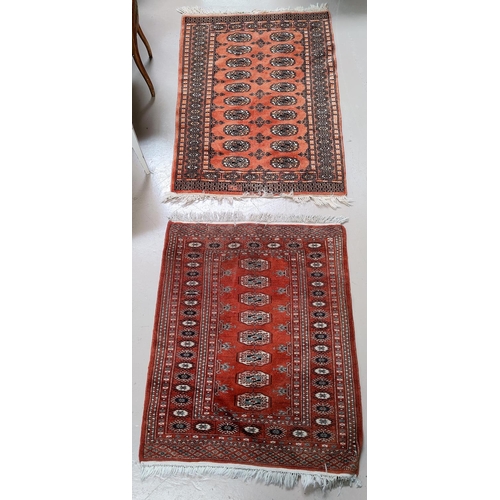 689 - Two small Bokhara rugs, hand knotted with rust ground
