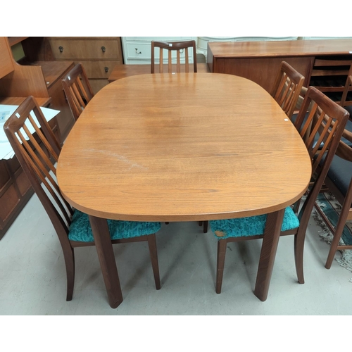 694 - A G-Plan teak dining suite comprising extending table with rounded rectangular top  and 6 chairs