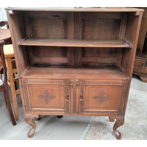 698 - An oriental 2 height bookcase in carved walnut, with cupboard under