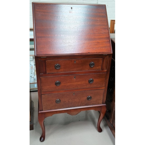 724 - A narrow inlaid mahogany fall front bureau with 3 drawers under