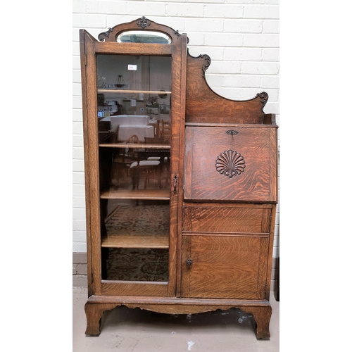 730 - A 1930's oak side by side display cabinet with full length glazed door, cupboard and fall front writ... 