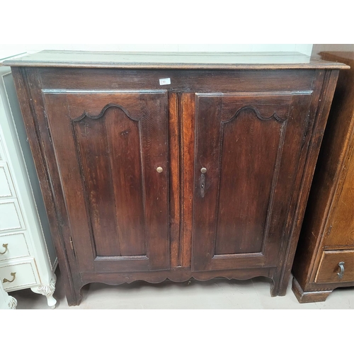 792 - An 18th/19th century oak panelled double door dole cupboard 126x46x125 cm
(back panel a.f)