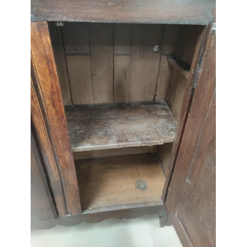 792 - An 18th/19th century oak panelled double door dole cupboard 126x46x125 cm
(back panel a.f)