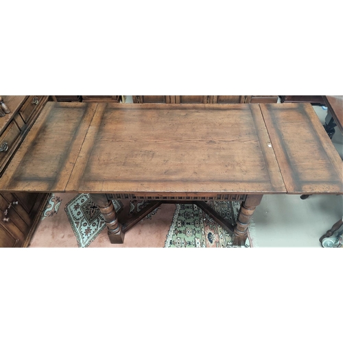 839 - An 18th century style distressed oak drawer leaf dining table in the Titchmarsh & Goodwin manner on ... 