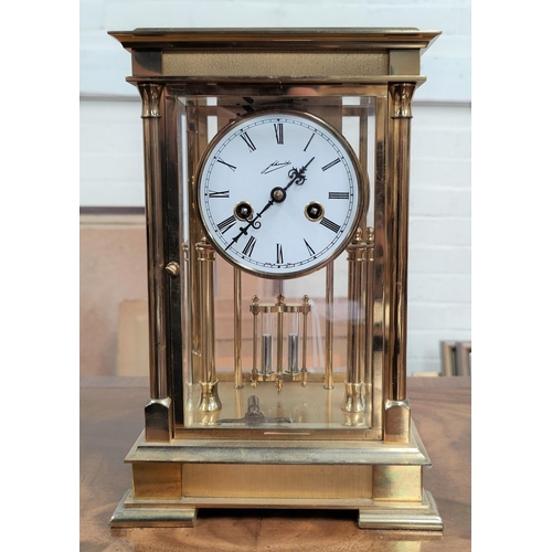 108 - A French 4 glass clock in brass case with white enamel dial and 8 day movement striking on bell with... 