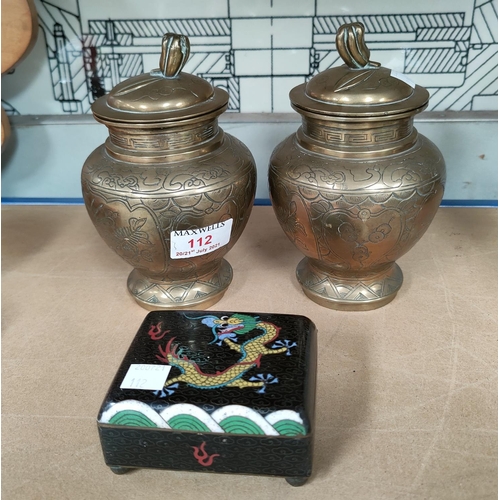 112 - A Chinese pair of brass tea jars, chased decoration, dragon mark to base, 16cm; a cloisonné rectangu... 