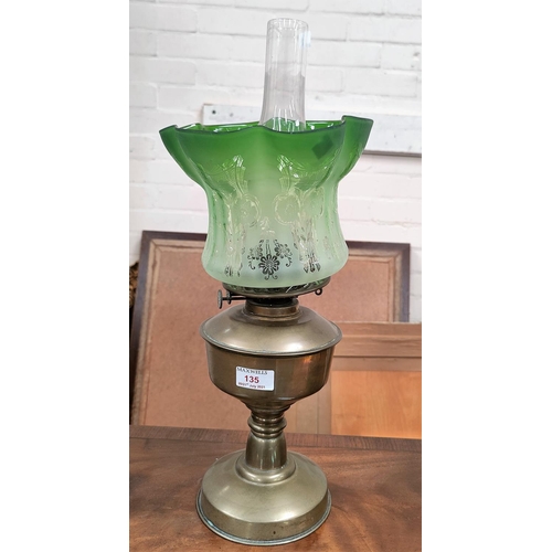 135 - A brass table lamp and shade (shade rim chip); a vintage case