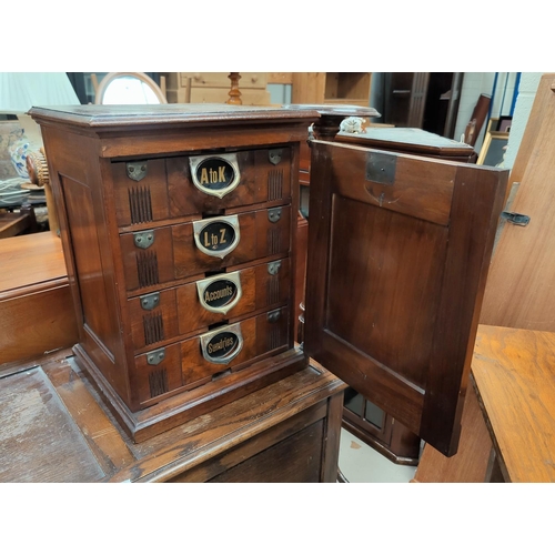139 - A Victorian Amberg's patent Index Filing cabinet with original card index files to each of the 4 dra... 