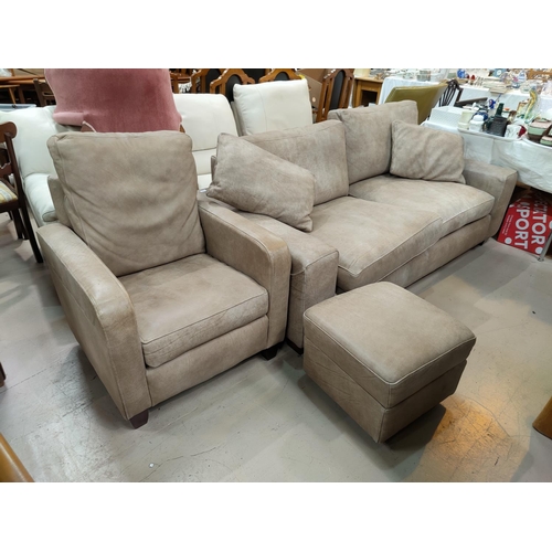 793 - A modern fawn coloured three seater settee, matching arm chair and foot stool