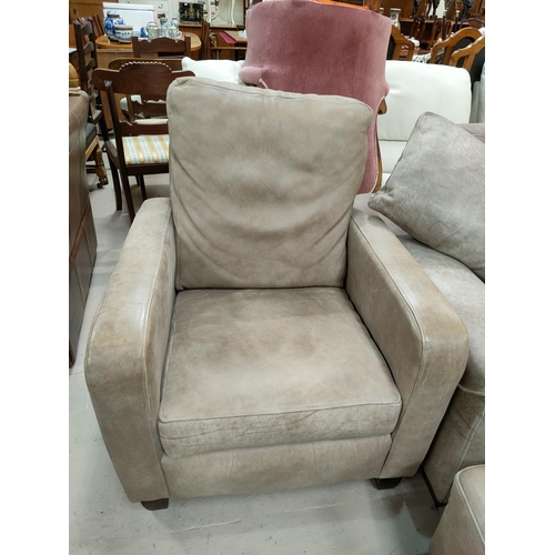 793 - A modern fawn coloured three seater settee, matching arm chair and foot stool