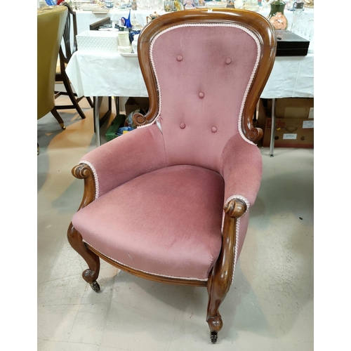 822A - A Victorian mahogany spoon back armchair in pink dralon