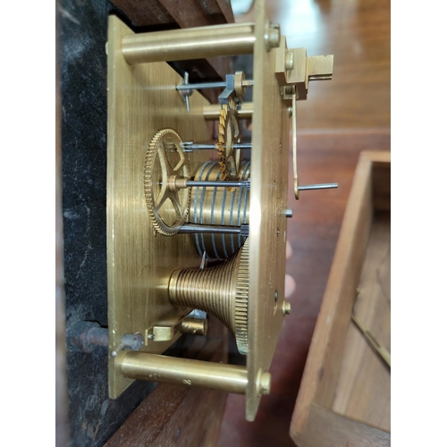 94 - A circular dial wall clock in mahogany case with single train fusee movement
