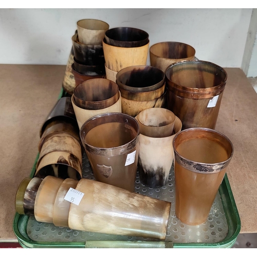 95 - Two silver rimmed horn cups and a selection of other similar horn cups