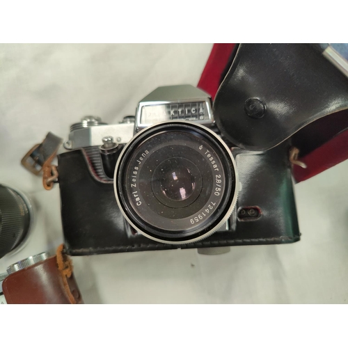 187 - A Praktica Nova B SLR camera with Carl Zeiss lens, a Zeiss Contina, a Palmer telephoto lens and anot... 