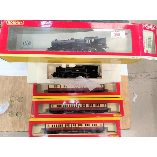 285 - A Hornby 00 gauge originally boxed BR 2-6-4 Stanier Class 4P, and three boxed Hornby carriages + a s... 