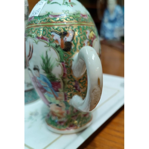345B - A Chinese famille verte tea pot decorated with panels of traditional scenes of birds and insects etc... 