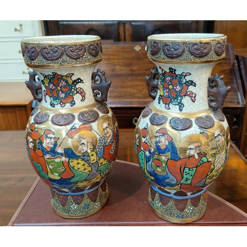 346G - A pair of oriental crackle glaze vases decorated with men with gilt haloes holding lanterns, charact... 