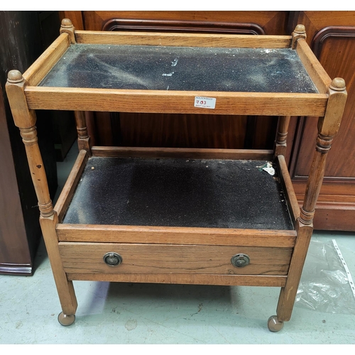 703 - A 1930's oak tea trolley with drawer below; a Victorian hall chair; a bedside cabinet; a dressing st... 