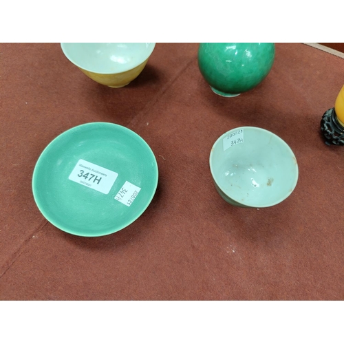 347H - A small selection of Chinese monochrome porcelain items including tea bowl on wooden stand, 6 charac... 